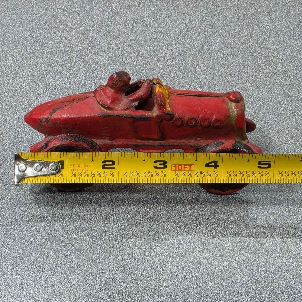 Antique Hubley Cast Iron Boat-tail Race Car Toy Driver 1920's.